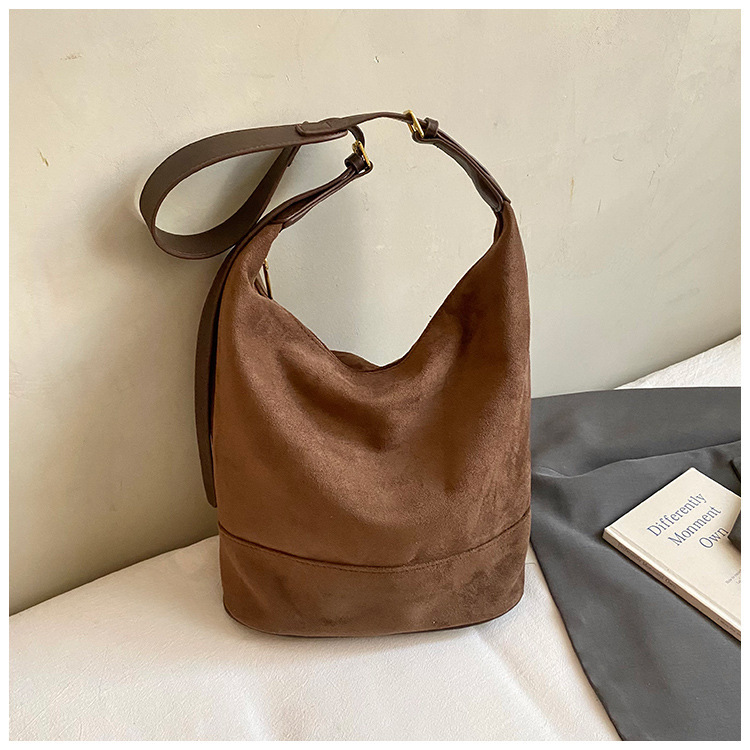 The Uptown Artisan: Vintage Suede Bucket Bag - Your Statement Piece